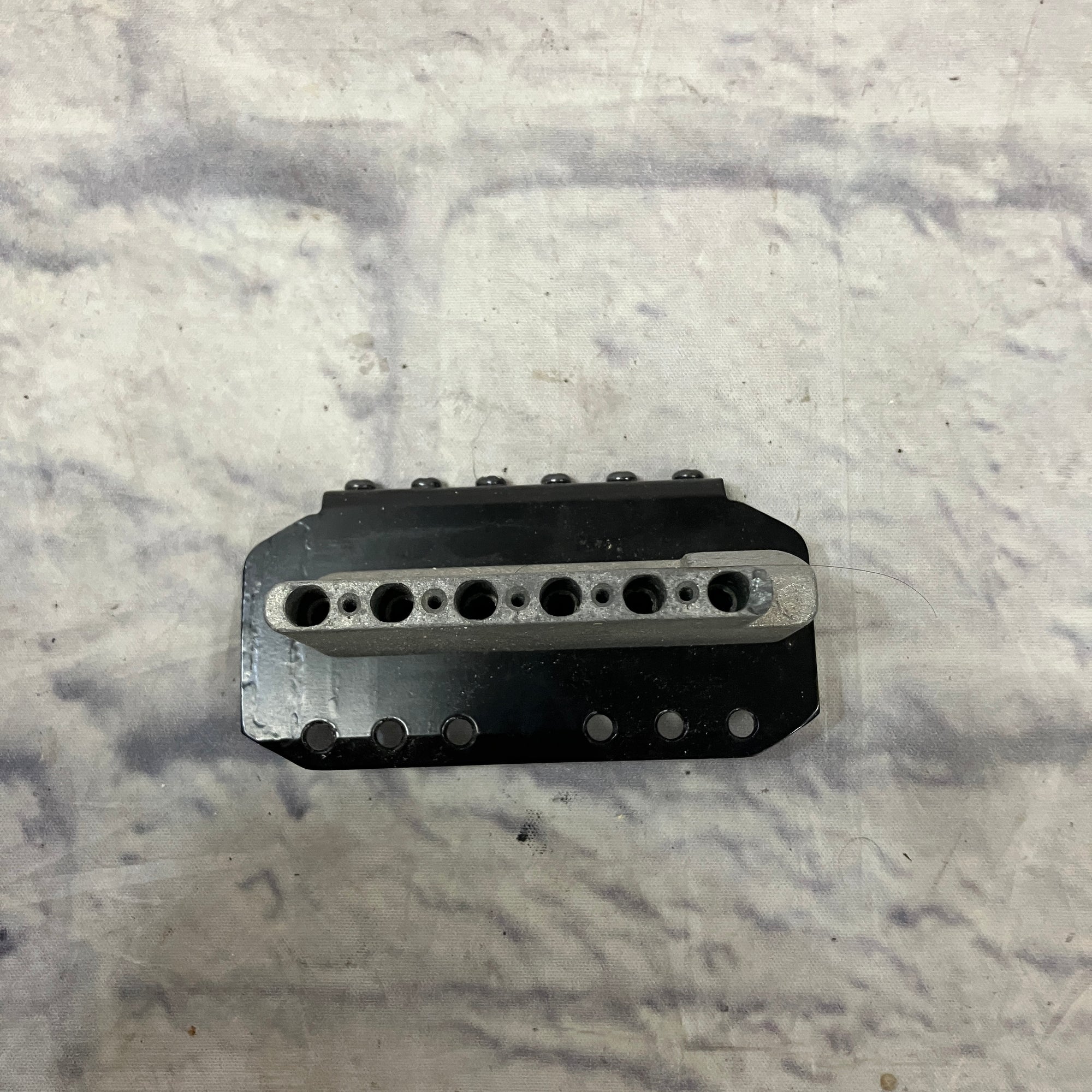 Unknown Black Guitar Bridge