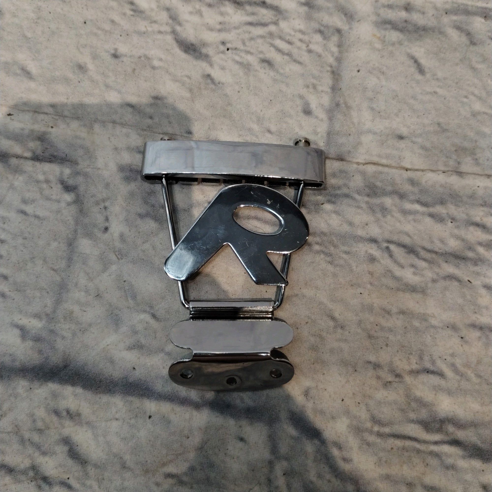 Unknown "R" Guitar Tailpiece