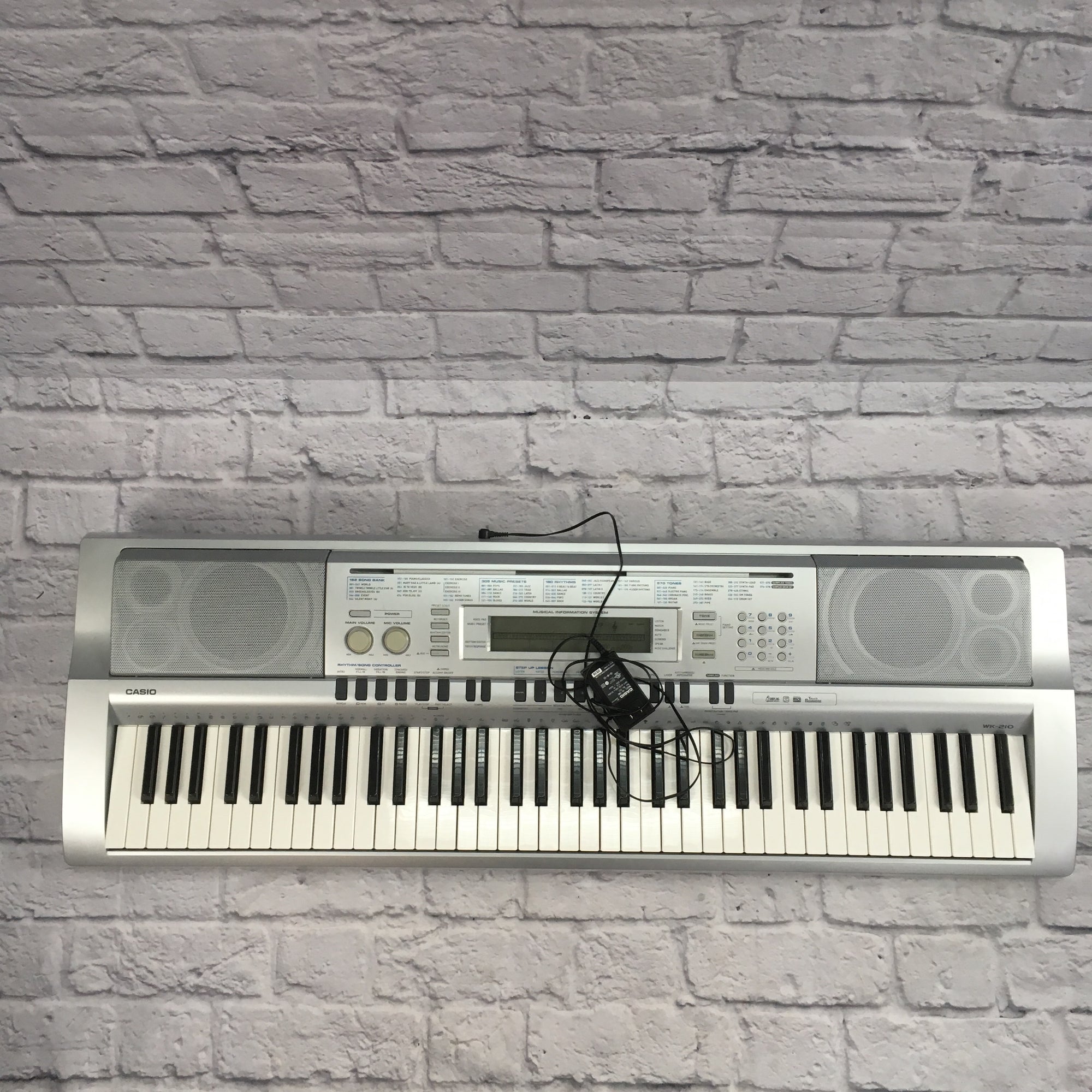 Piano casio wk outlet 210