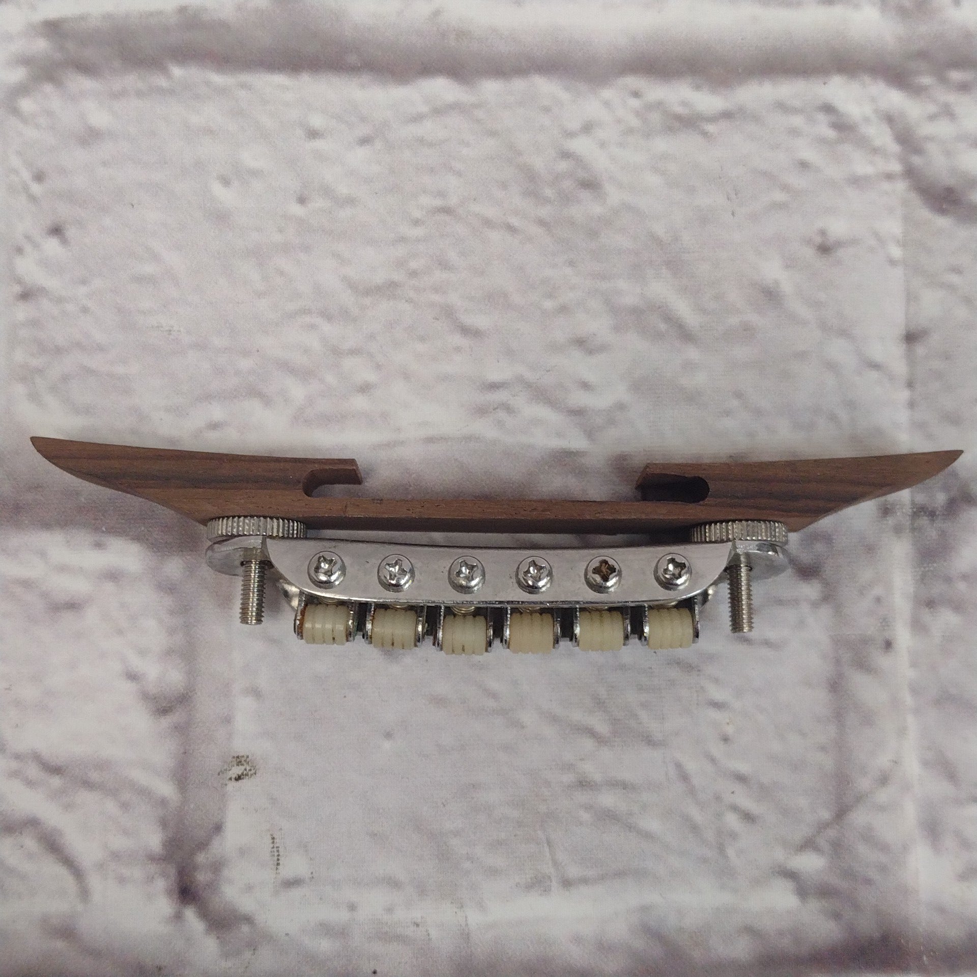 Unknown Archtop Guitar Bridge with Nylon Roller Saddles
