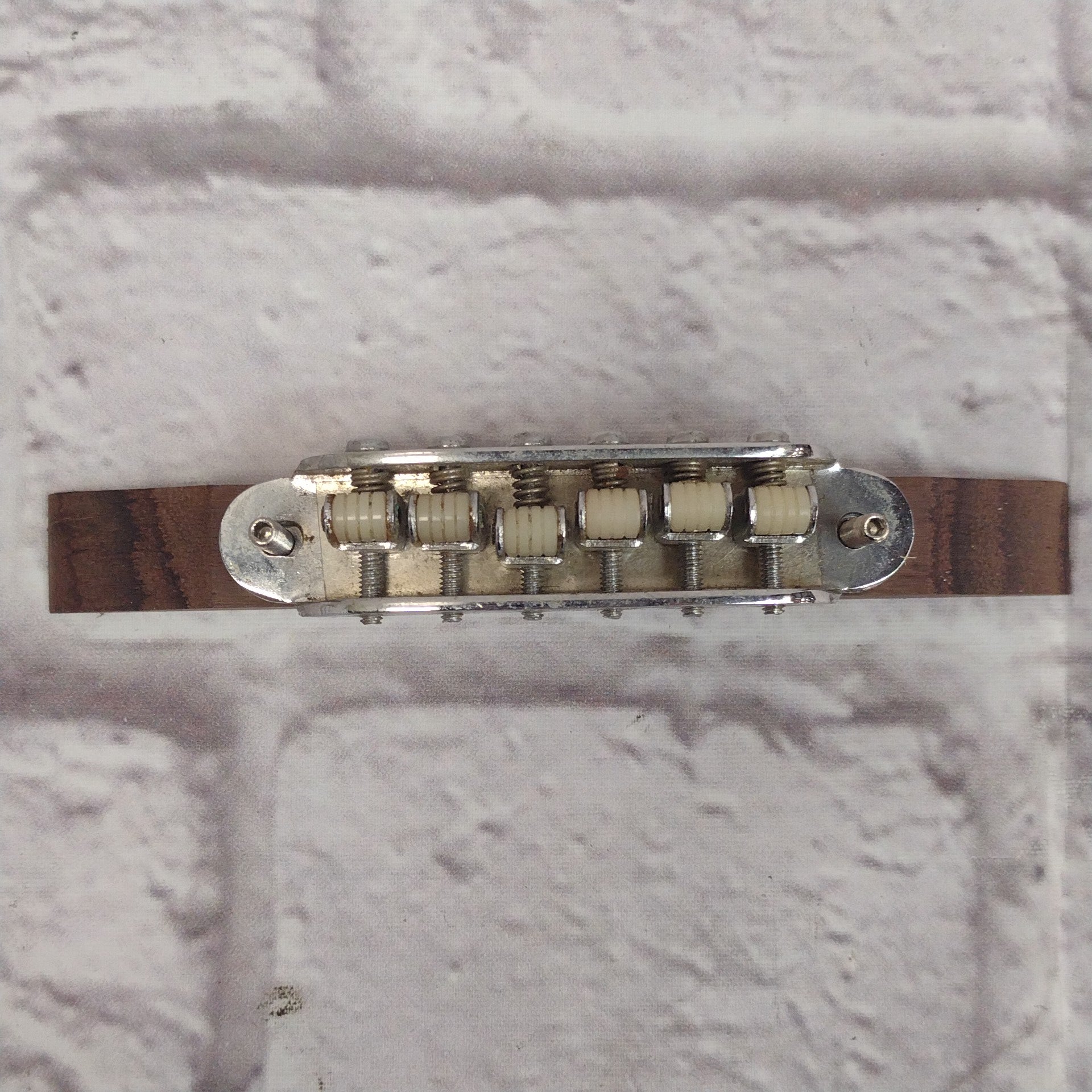 Unknown Archtop Guitar Bridge with Nylon Roller Saddles