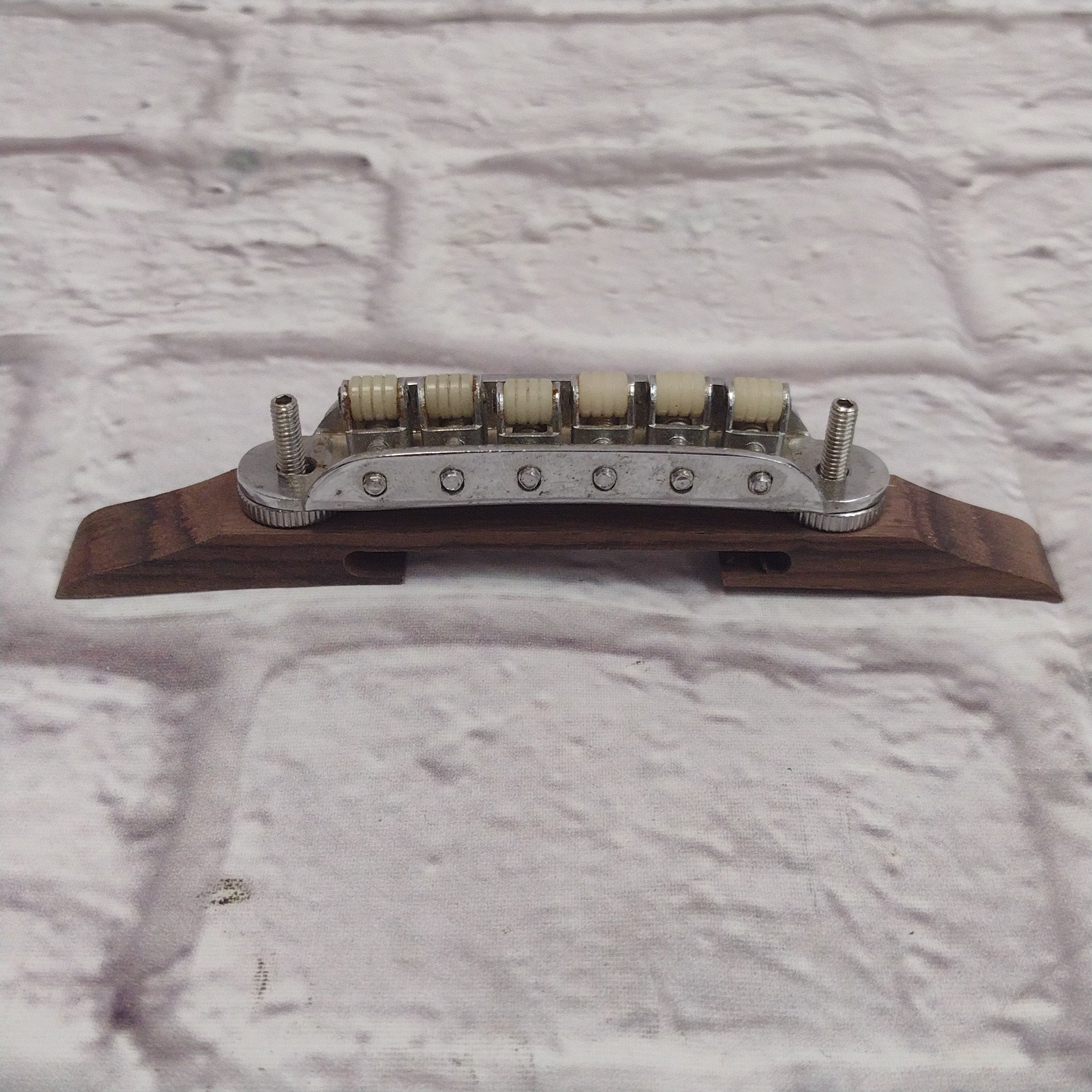 Unknown Archtop Guitar Bridge with Nylon Roller Saddles