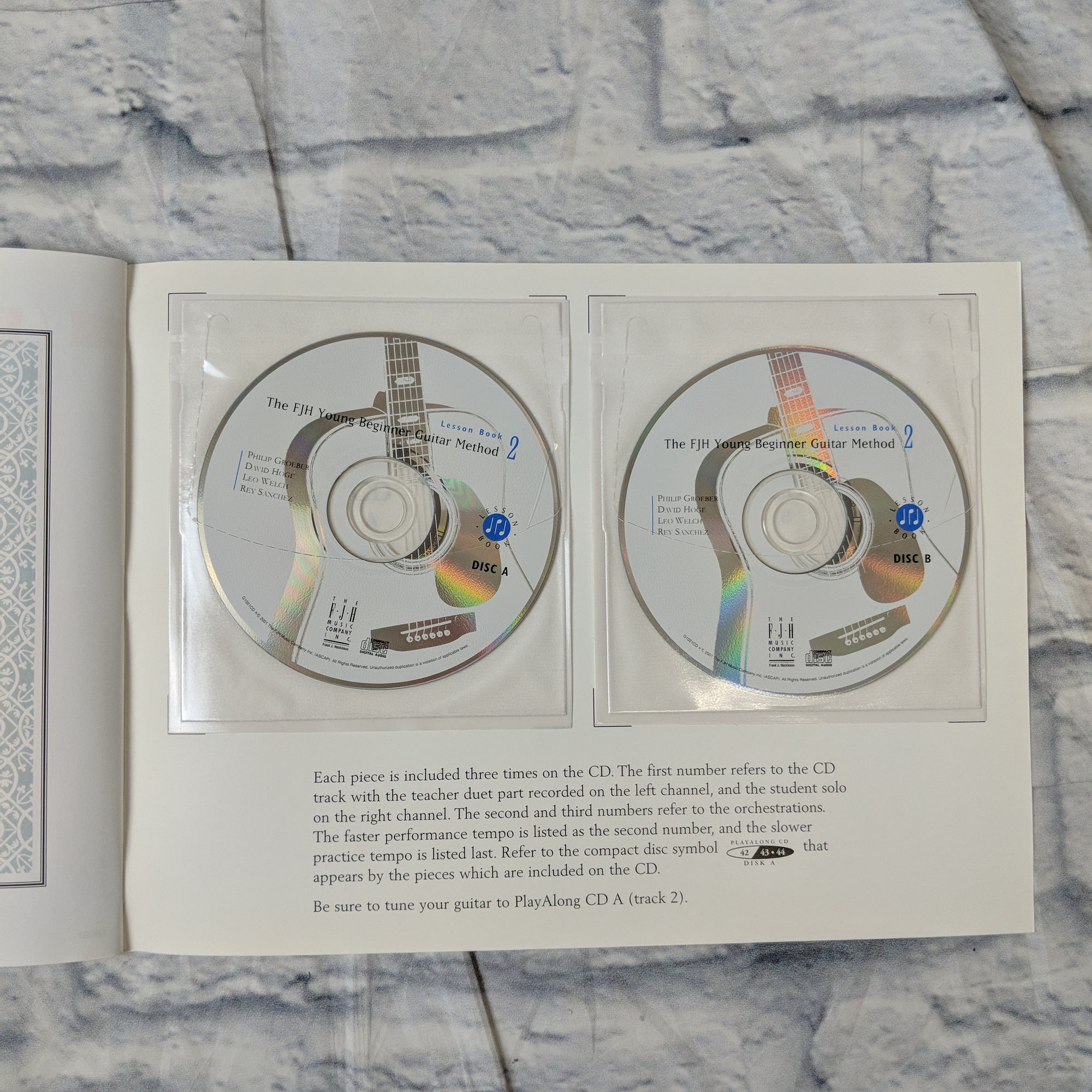 The FJH Young Beginner Guitar Method, Lesson Book 2 with 2 CDs