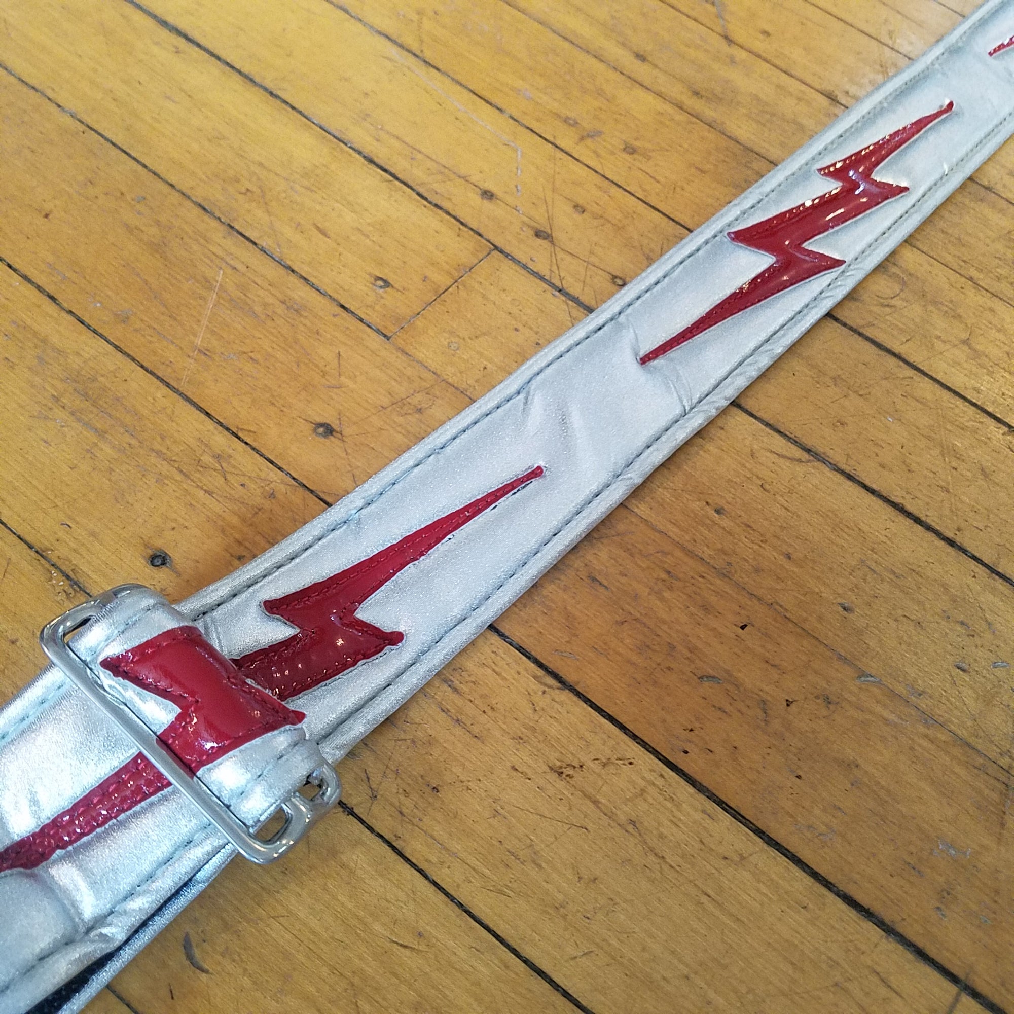 Jodi Head Silver and Red Bolt Slider Guitar Strap